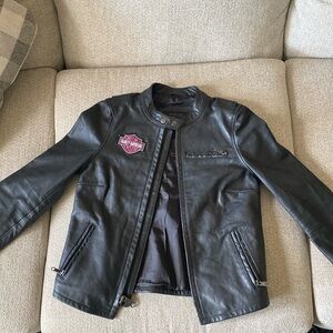 Harley Davidson leather coat with pink harley davidson patches sewed on